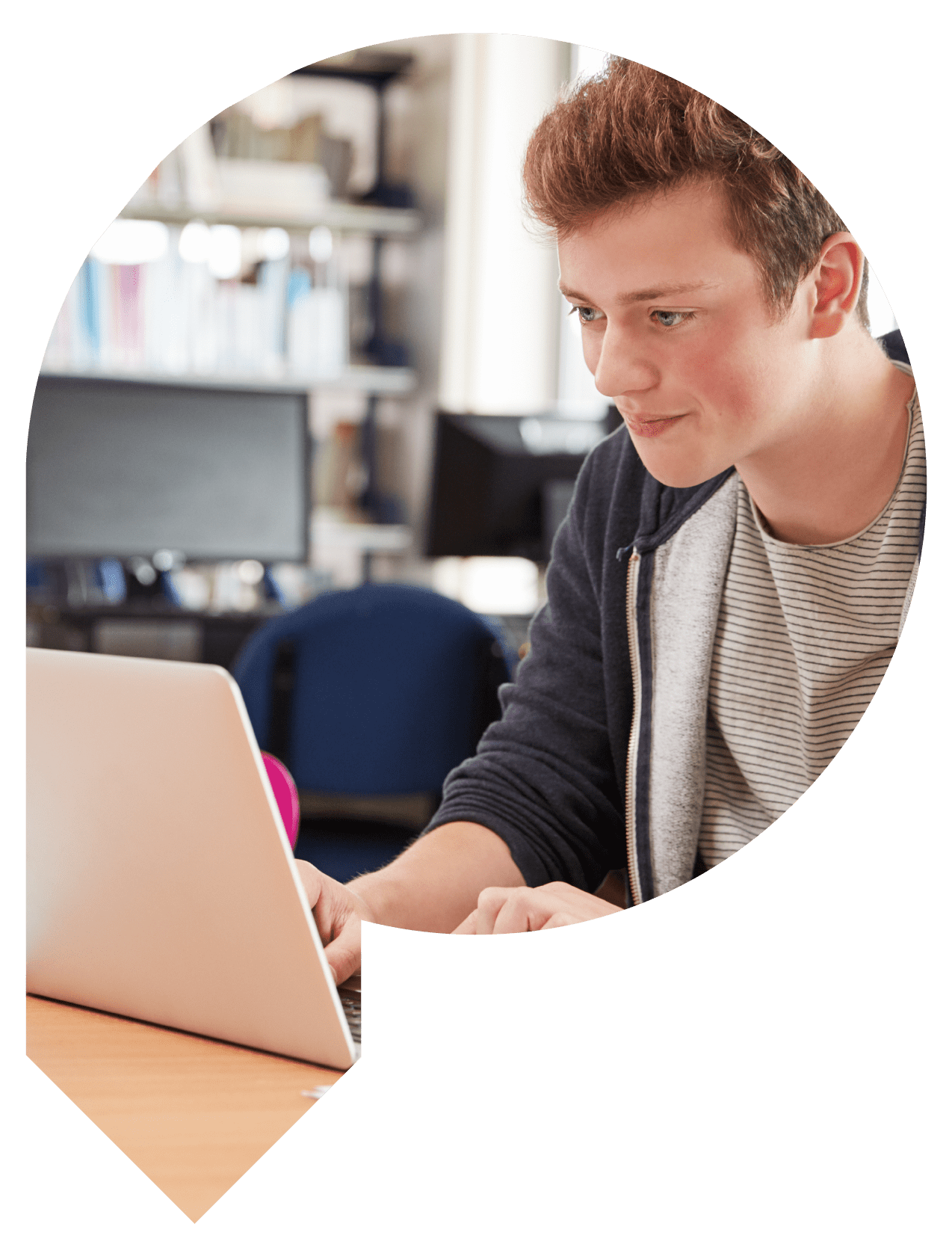 Student working on a laptop whilst smiling
